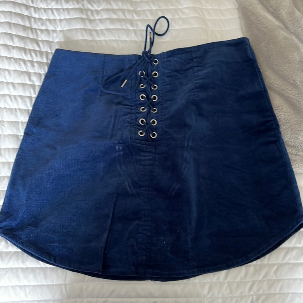 Blue suede mini shirt.